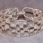 12 strand Siilver Lace and rose quartz bracelet.  Hand knotted of sterling silver and natural stone, 1" wide, easy clasp, specify size   $85.00