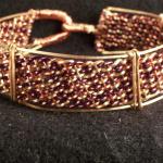Copper and enameled copper hand woven bracelet.  3/4" wide.  easy clasp, does not need polishing.  $80.00
