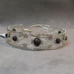 Silver lace 8 strand tourmaline bracelet.  Sterling and natural stone, easy clasp hand knotted and woven.  
$75.00