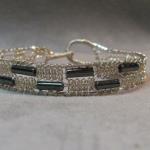 6 strand Silver Lace bracelet with hematite beads.  Hand knotted and woven, easy clasp, 1/2" wide, specify size
$80.00