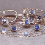 8 strand Silver Lace and sodalite bracelet.  Hand knotted and woven sterling silver with natural stone.  Easy clasp, specify size.  $80.00